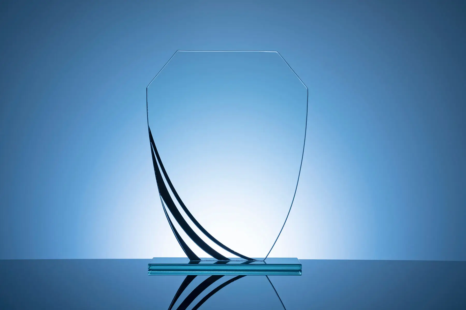 elegant blank glass shield trophy on dark blue 2026 01 07 02 23 10 utc.jpg